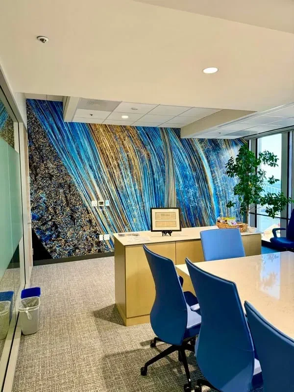 Blue wallpaper creating a focal point in a dining room