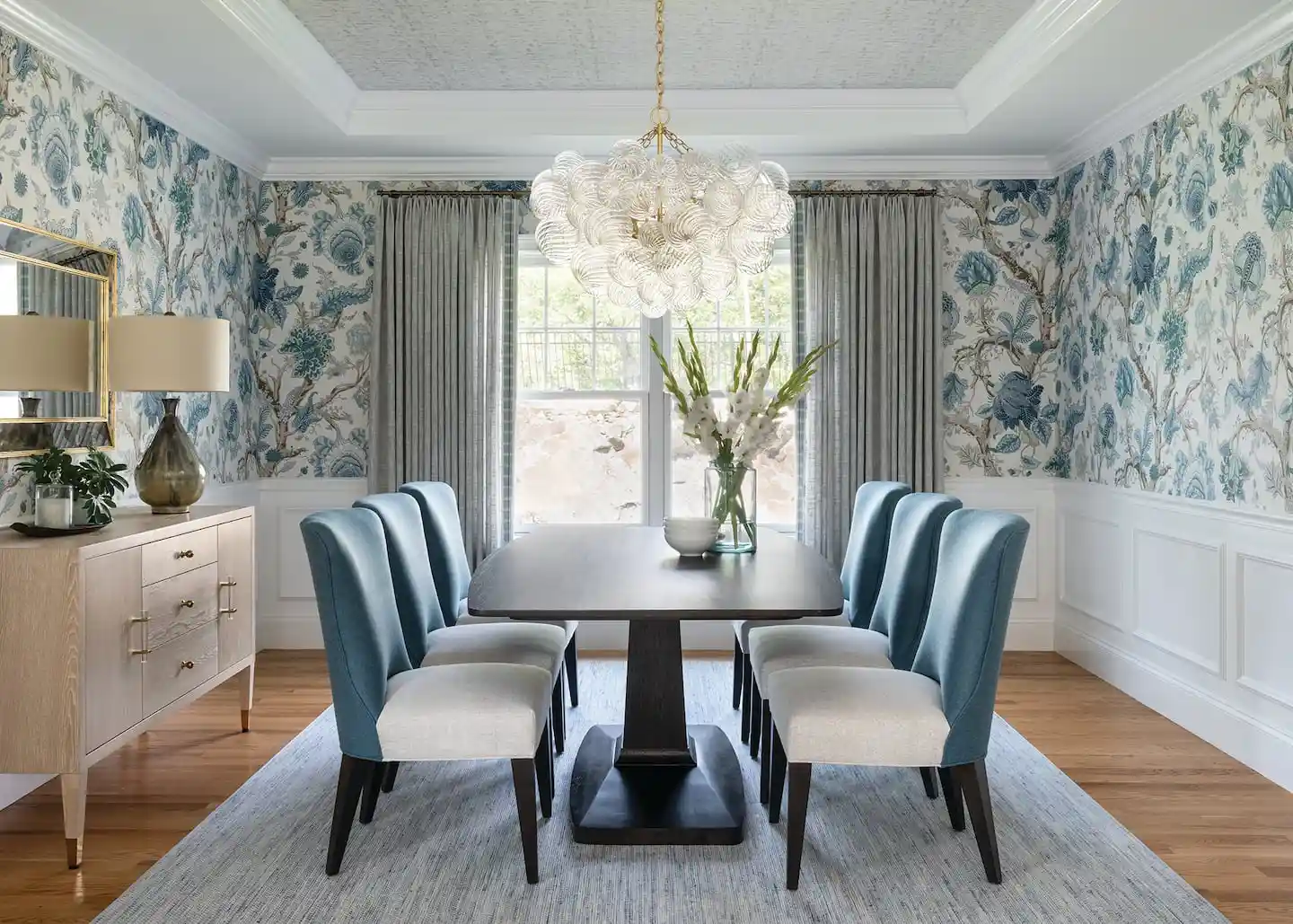 Dining room with coordinated wallpaper and carefully placed furnishings